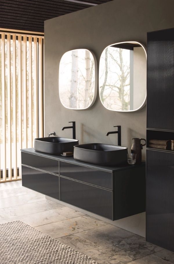 A bathroom with two black sinks AI-generated content may be incorrect.