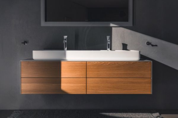 A bathroom sink with a mirror AI-generated content may be incorrect.